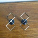 Pair of vintage candle holders in black metal and brass Sweden 1960