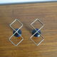 Pair of vintage candle holders in black metal and brass Sweden 1960