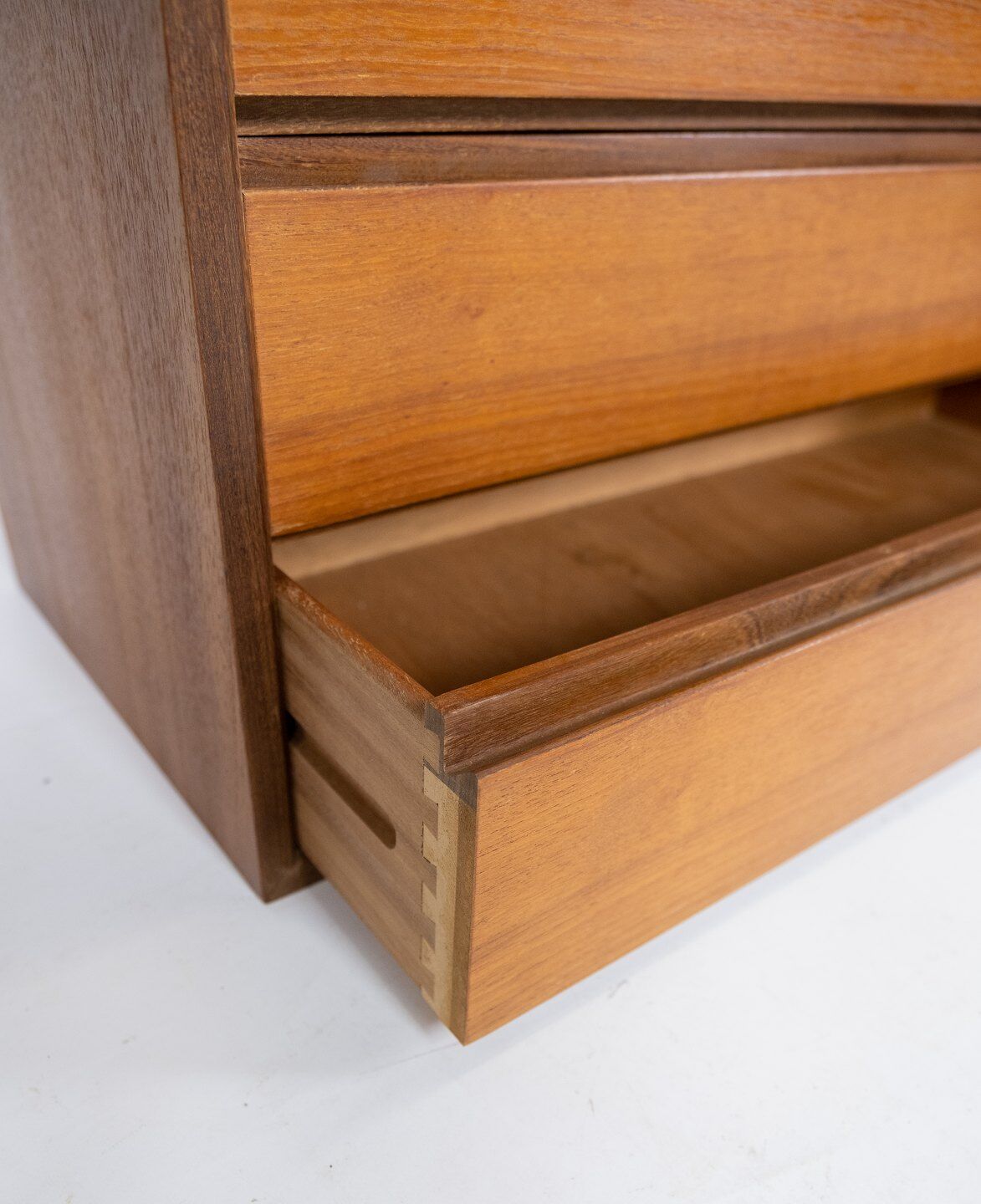 Wall mounted cabinet in teak of danish design from the 1960s.