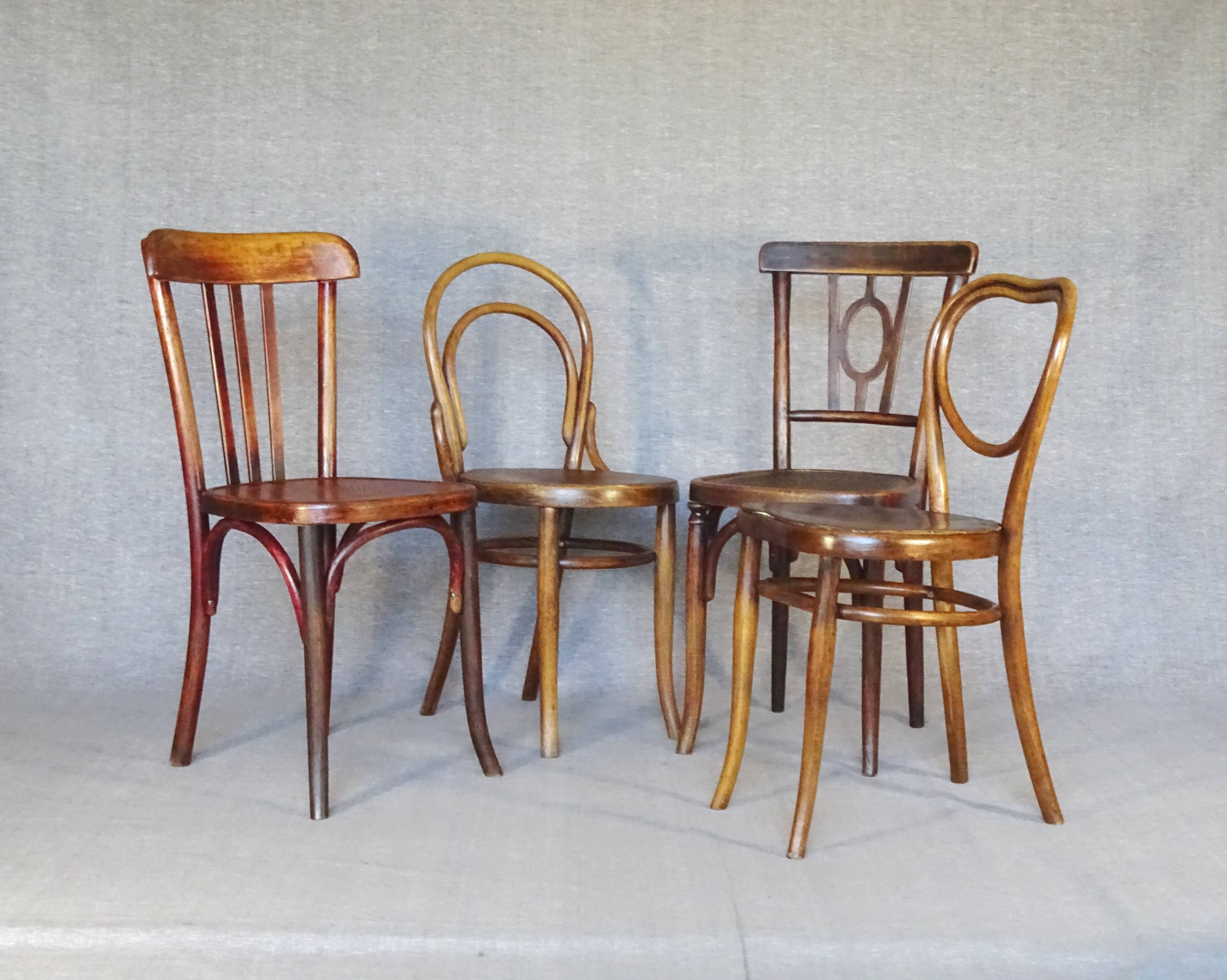 Set of 4 mismatched bistro chairs, 1900 to 1930 with wooden seats, Thonet, Baumann