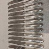 12 silver-plated table knives, Christofle goldsmith ribbons