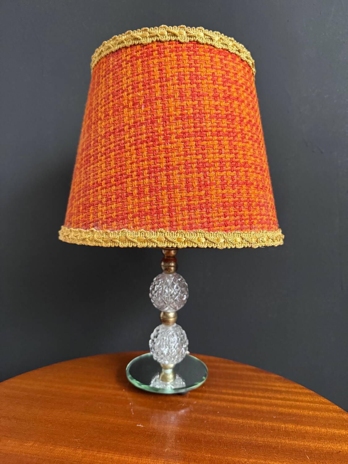 Small glass, mirror, and brass lamp from the 1960s.