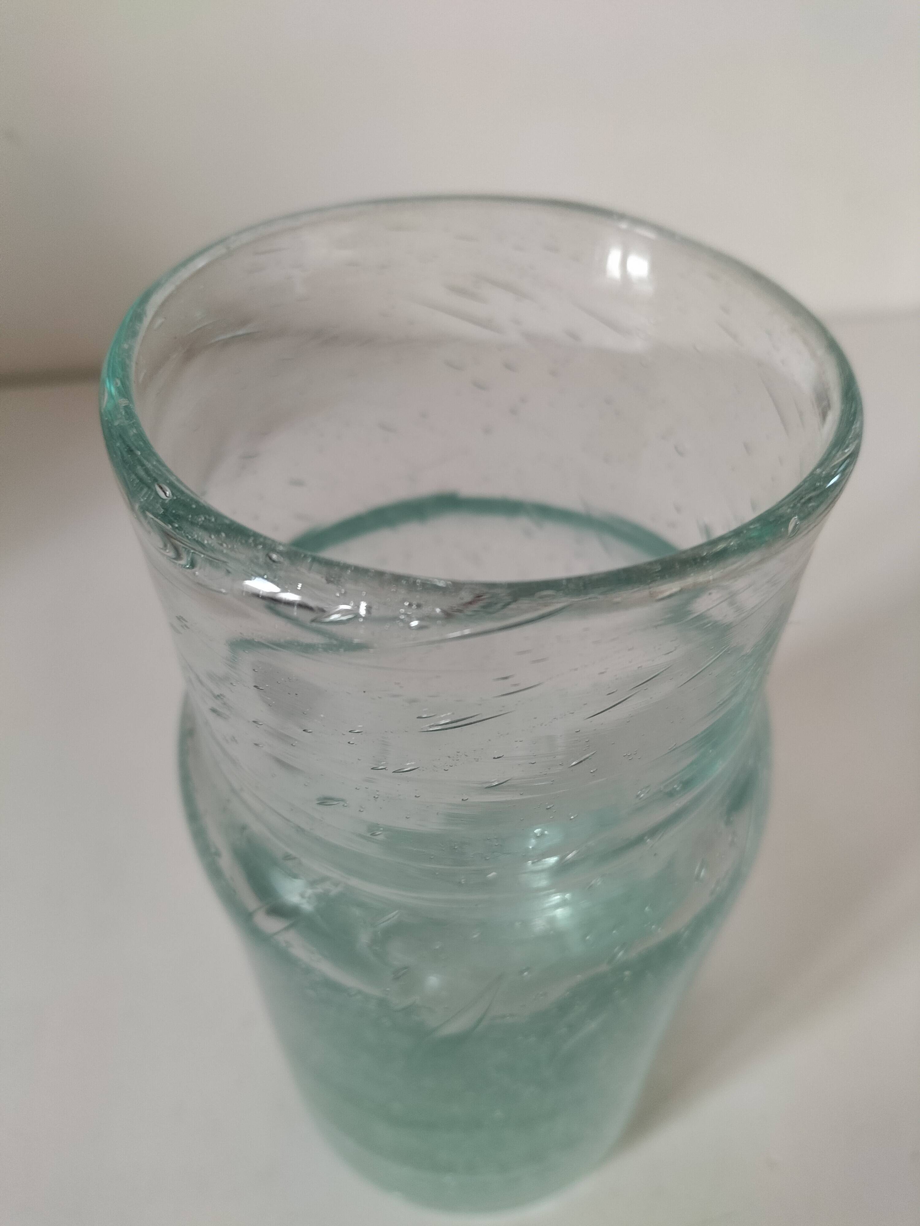 Vintage vase in very pale green bubbled glass, handcrafted