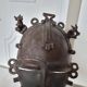 African bronze mask on pedestal, from Ivory Coast, dating