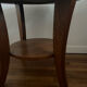 Low round art deco table in honey wood