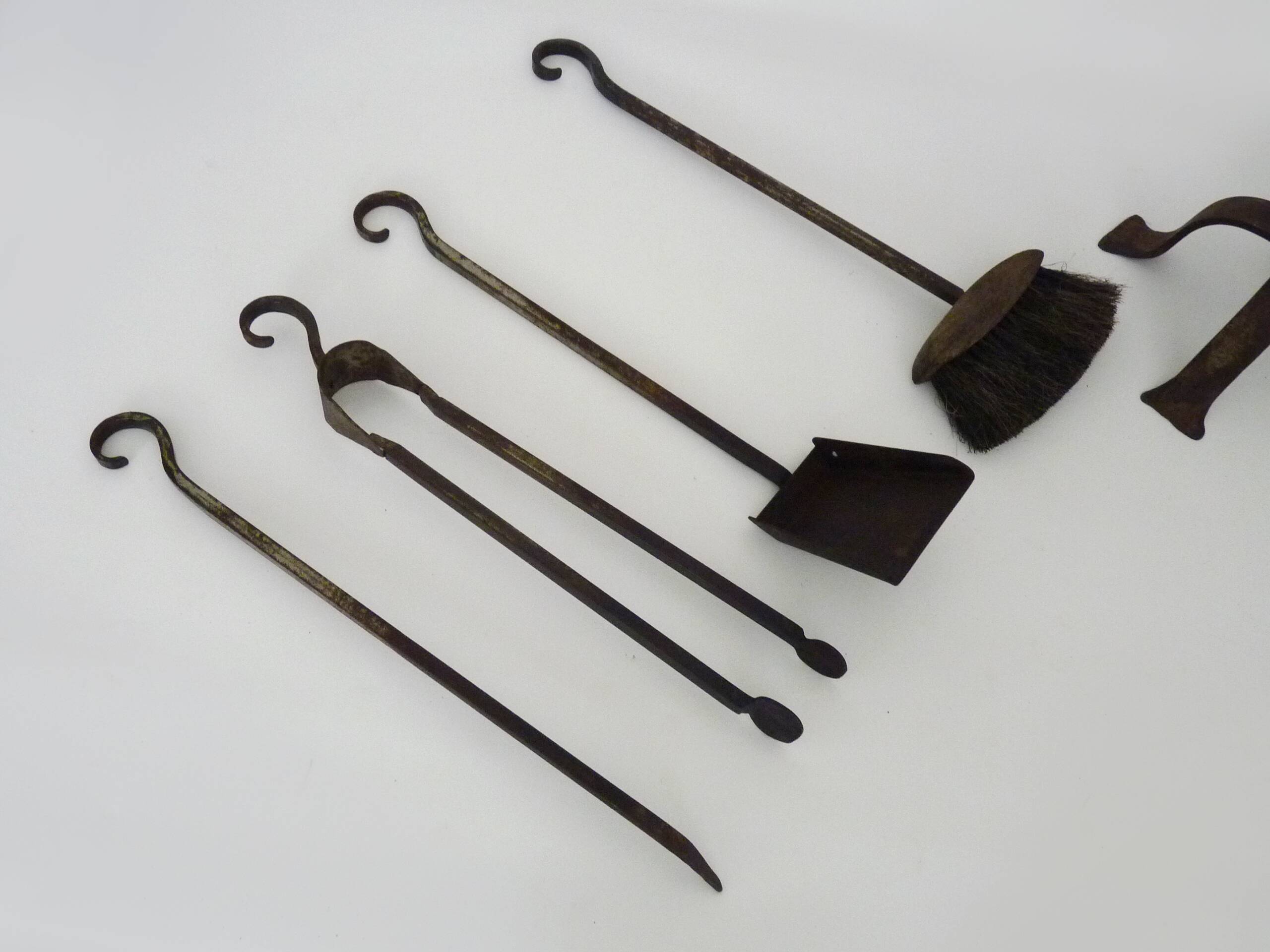 Pair of wrought iron andirons with 19th century fireplace set
