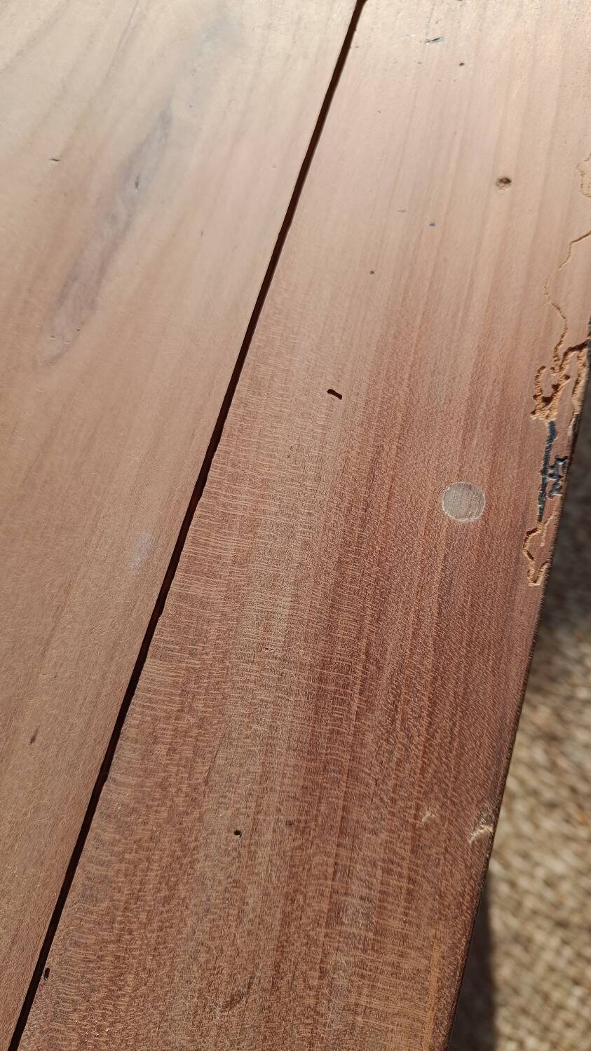 Low farmhouse table in raw wood