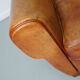 Vintage french moustache back cognac-colored leather club chair