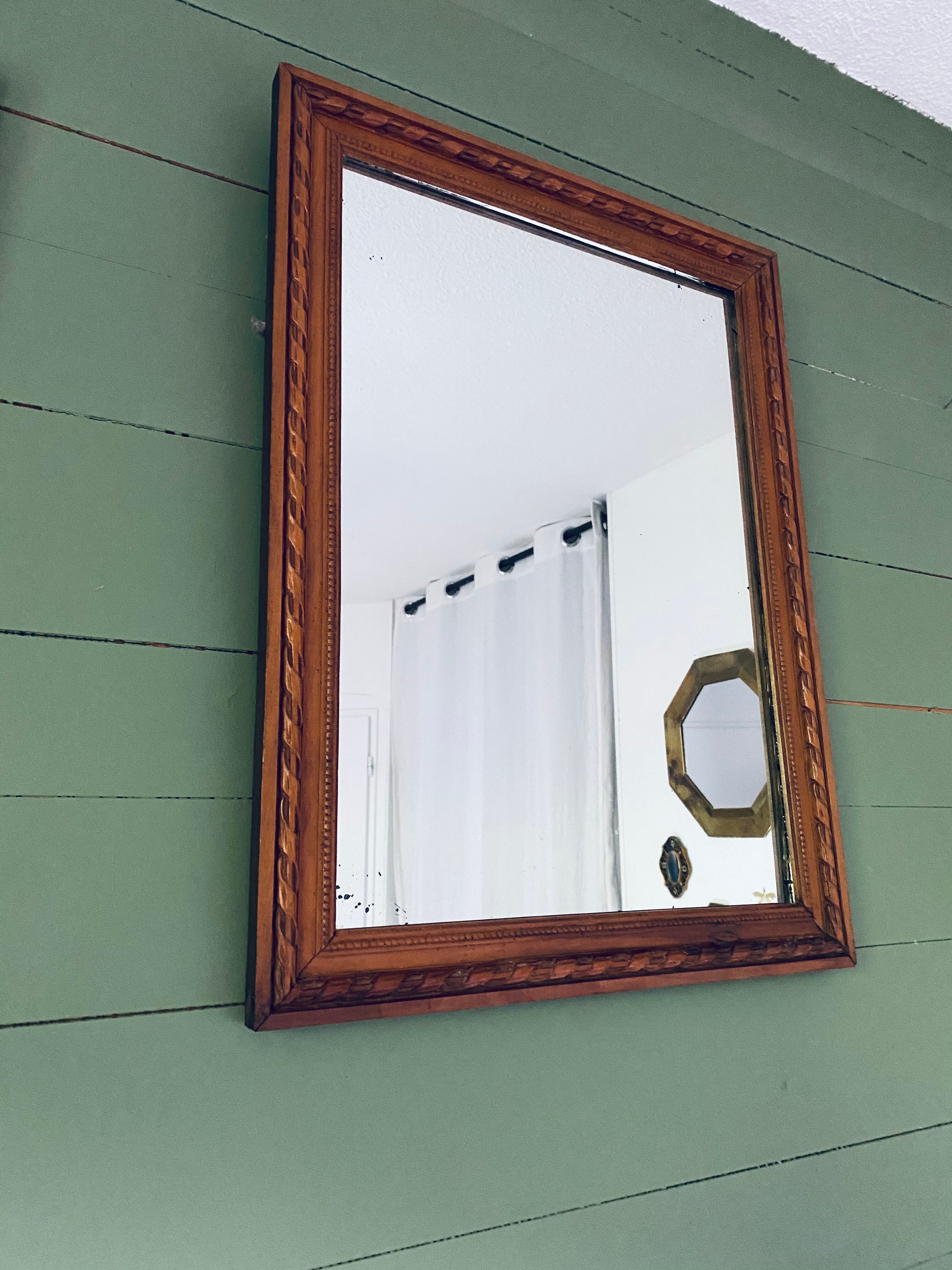 Antique mirror in carved wood and mercury 48x63cm