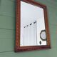 Antique mirror in carved wood and mercury 48x63cm
