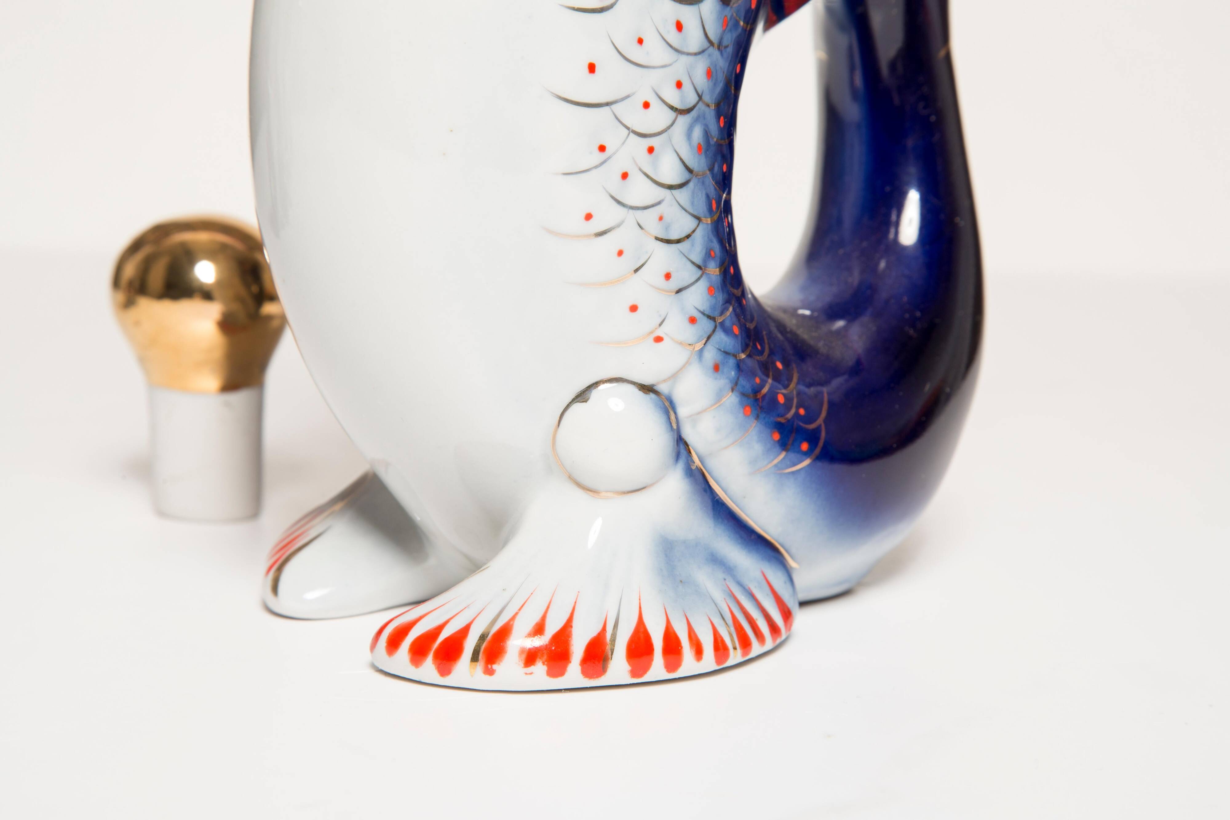Set of 7 glasses and a glass carafe decorated with blue fish, Mid-Century Modern style, Europe, 1960s.