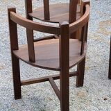 Set of three brutalist tripod armchairs in carved solid oak