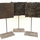 Set of three old ink pads on base
