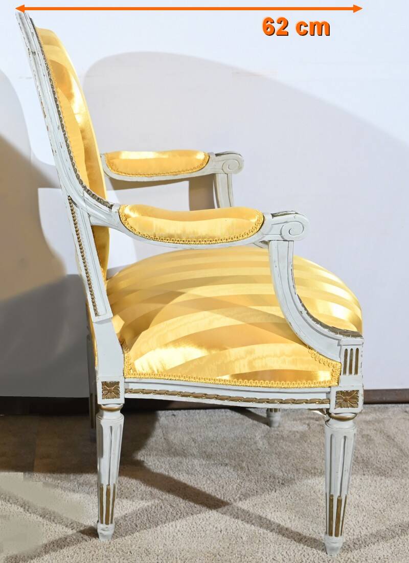 Pair of Cabriolet Armchairs, in rechampi wood, Louis XVI style – Late 19th century