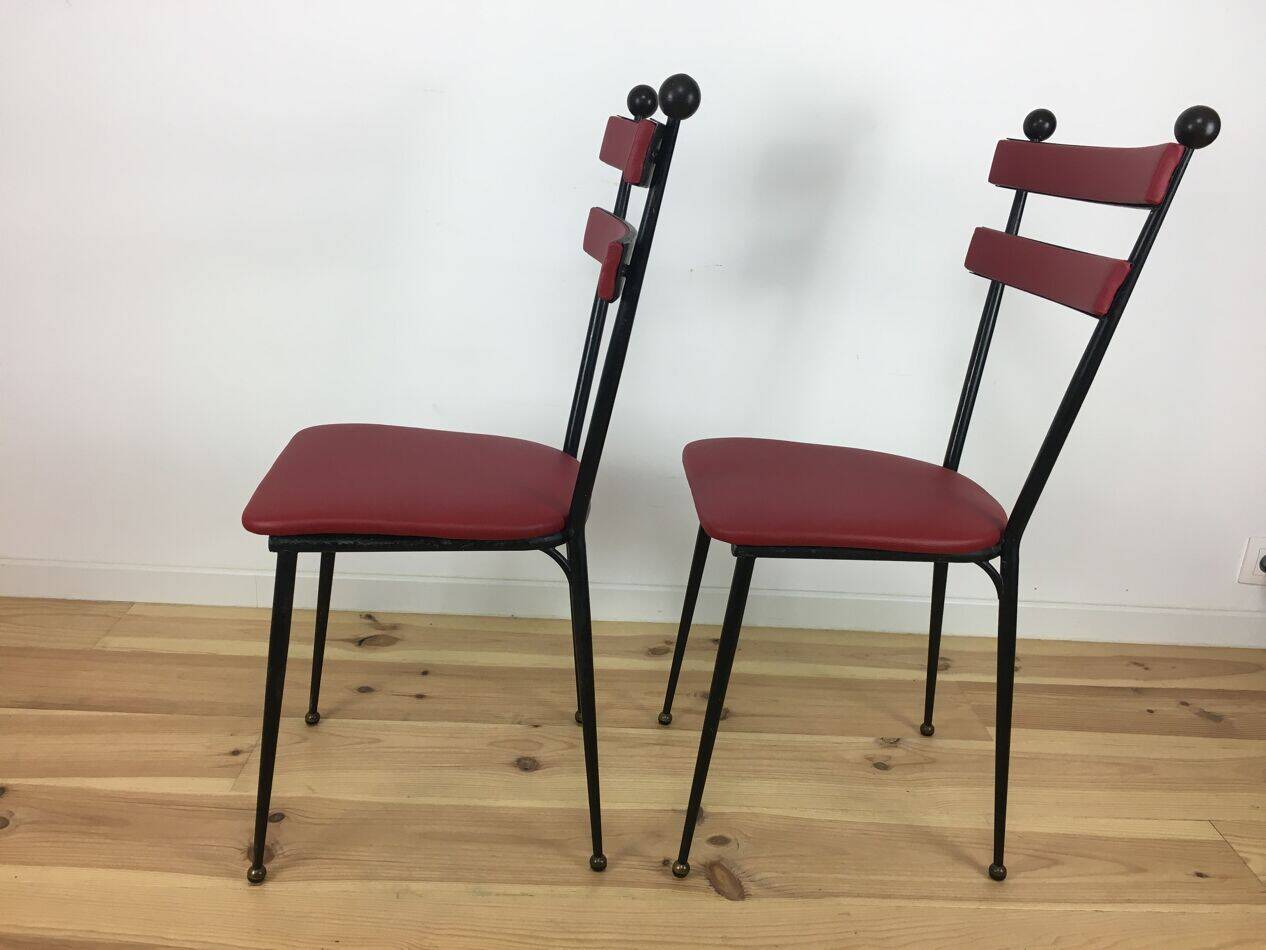Pair of 1950s chairs in metal and red faux leather, Gueden-Adnet style.