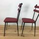 Pair of 1950s chairs in metal and red faux leather, Gueden-Adnet style.