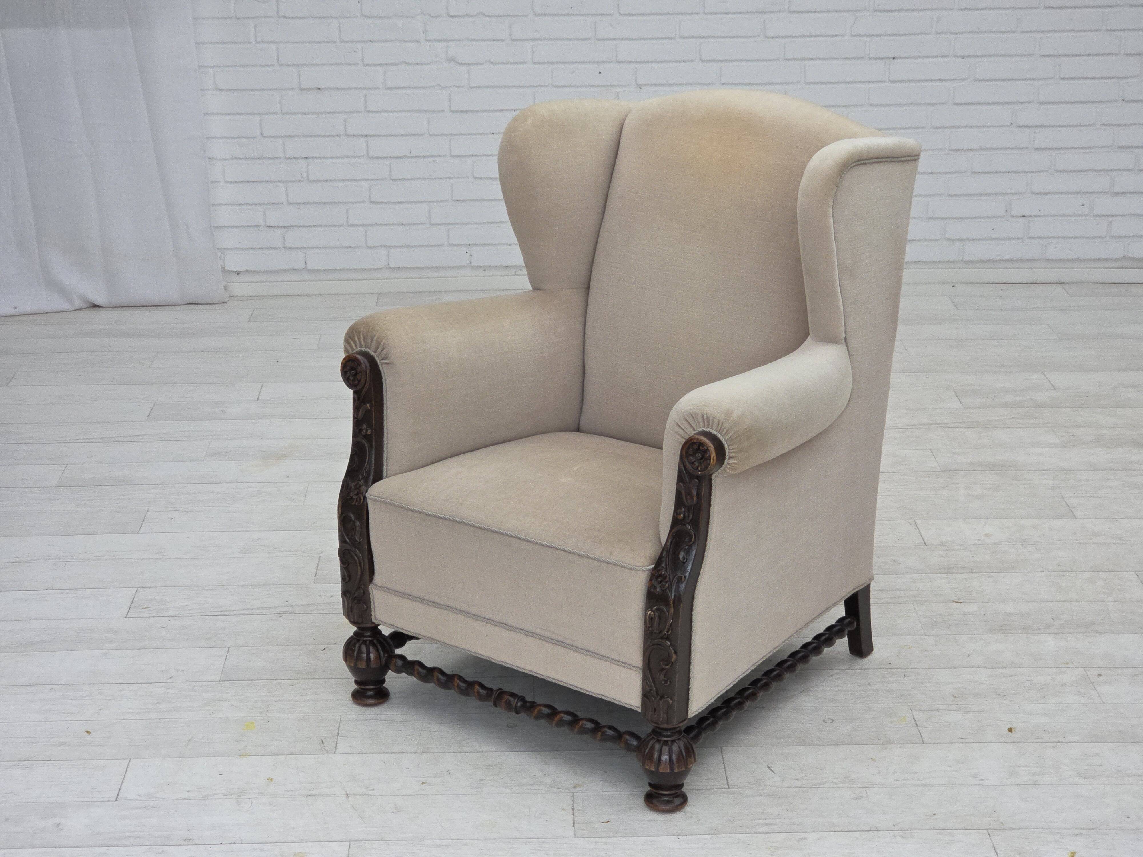 1960s, Danish wingback armchair, furniture velour, carved oak wood.