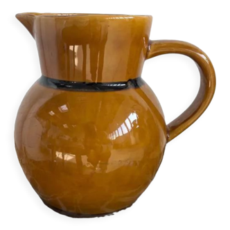 Light brown pitcher glazed with black edging