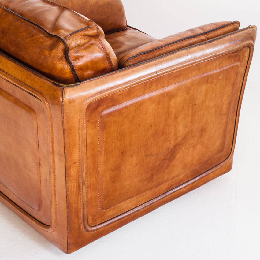 Vintage club armchair by Roche Bobois. Camel buffalo leather. France, 1980s.