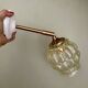 Vintage amber glass globe wall light