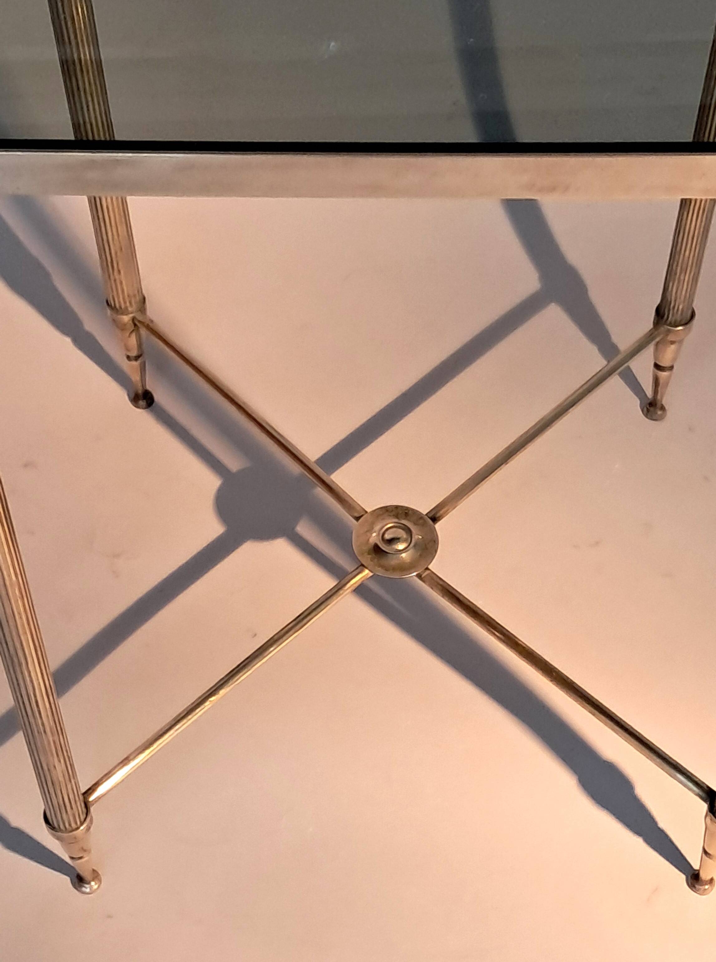 Gold brass side table in neoclassical style, circa 1960.