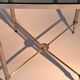 Gold brass side table in neoclassical style, circa 1960.