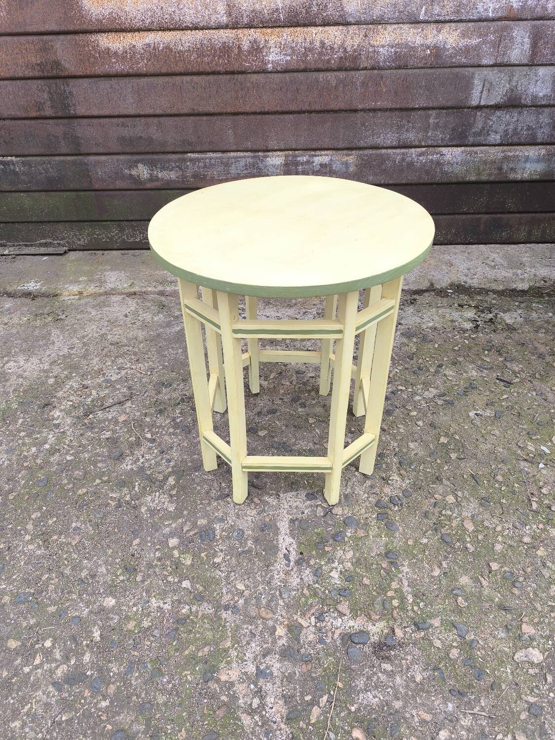 Yellow and green patinated pedestal table by a local artist