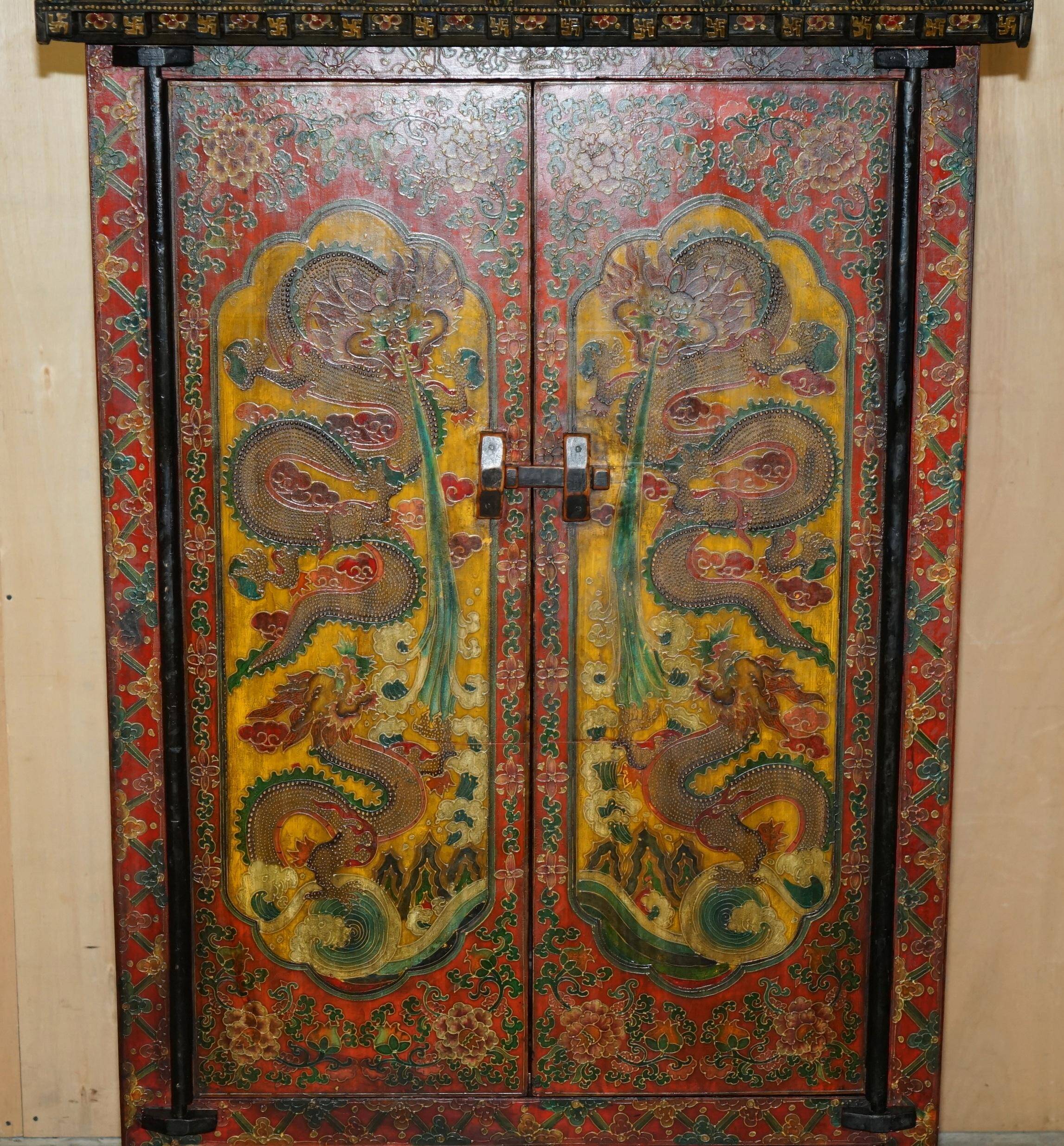 Vintage Chinese wardrobe painted with pagoda and drawers.