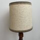 Brutalist floor lamp in turned wood, in the style of Charles Dudouyt.