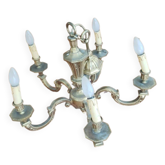 Large old chandelier in gilded brass
