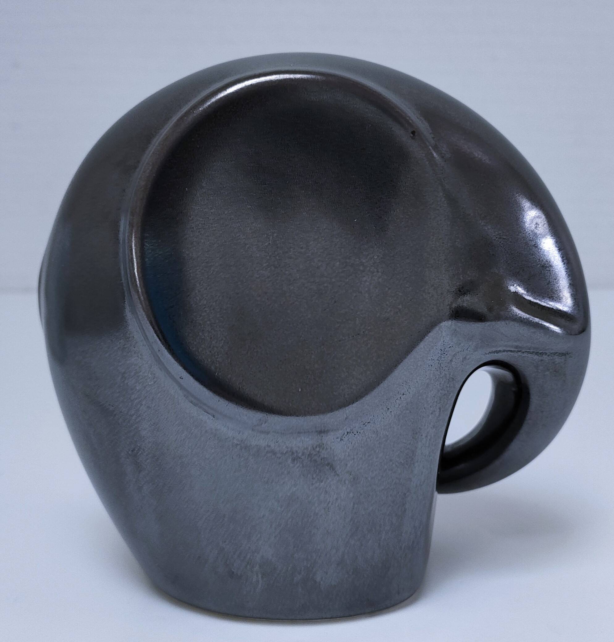 Two iridescent black and white ceramic elephants design