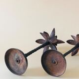 Pair of patinated metal candlesticks
