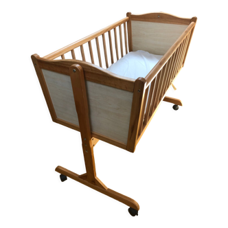 Wooden baby cradle with wheels