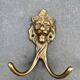 Antique brass lion coat hook