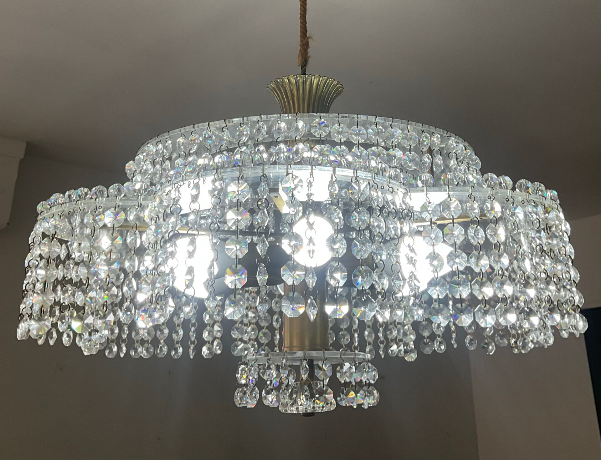 Vintage lucite chandelier with a cascade of crystal pendants from the 1970s.