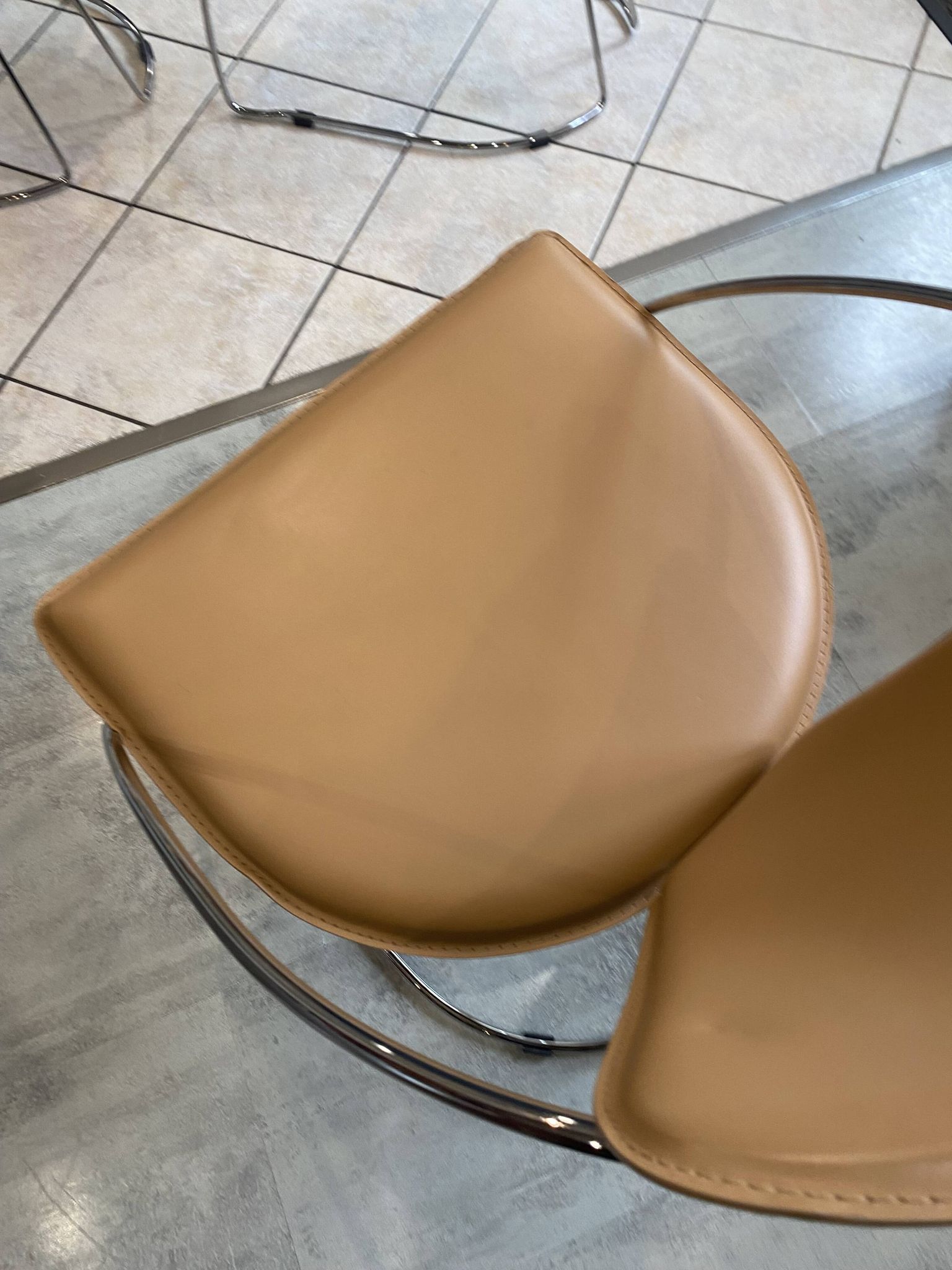 1 Linda armchair chair by Arrben in camel brown leather with a chrome steel frame.