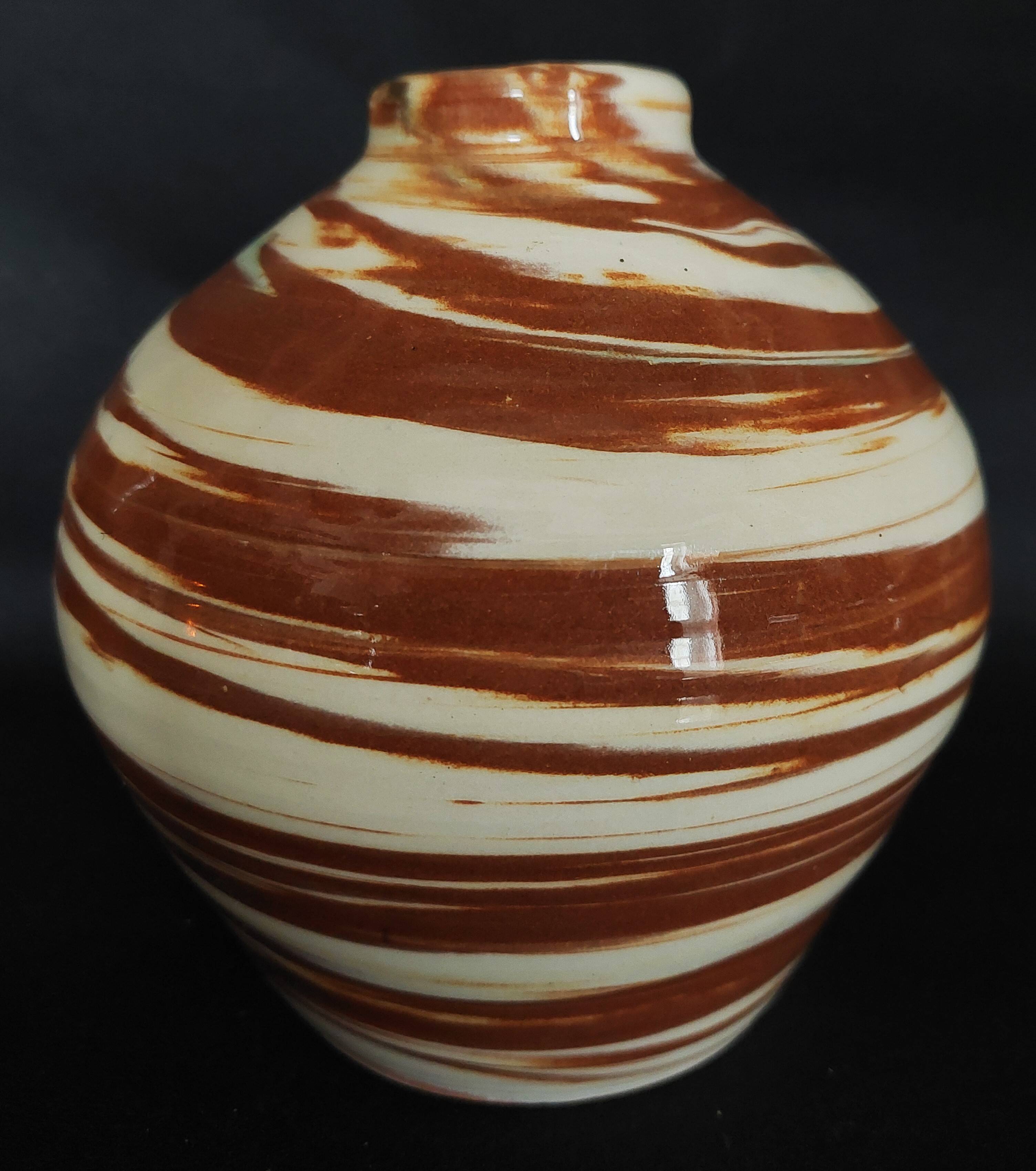 Vintage mixed clay vase