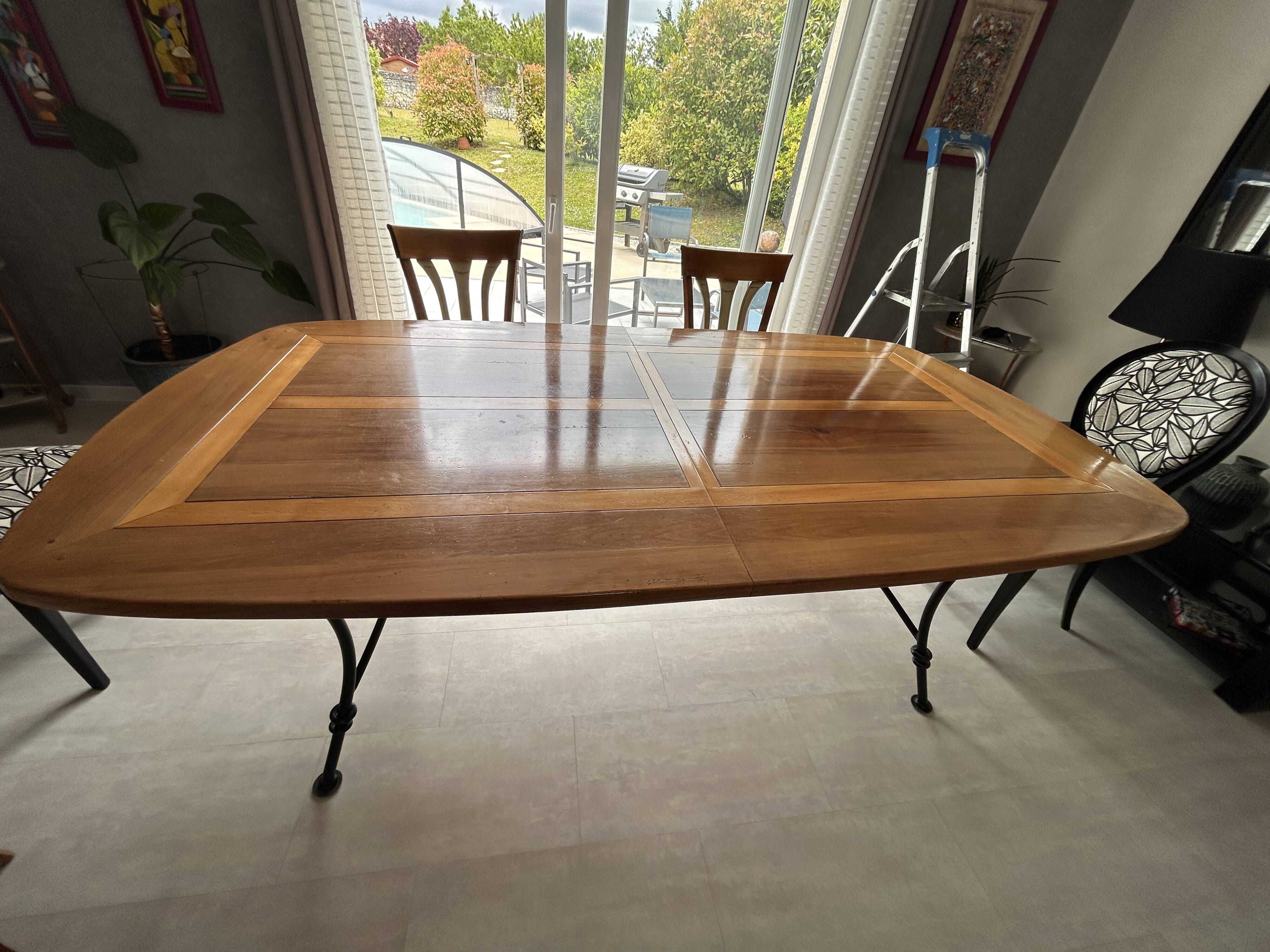Extendable table in cherry wood with wrought iron legs.