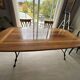 Extendable table in cherry wood with wrought iron legs.
