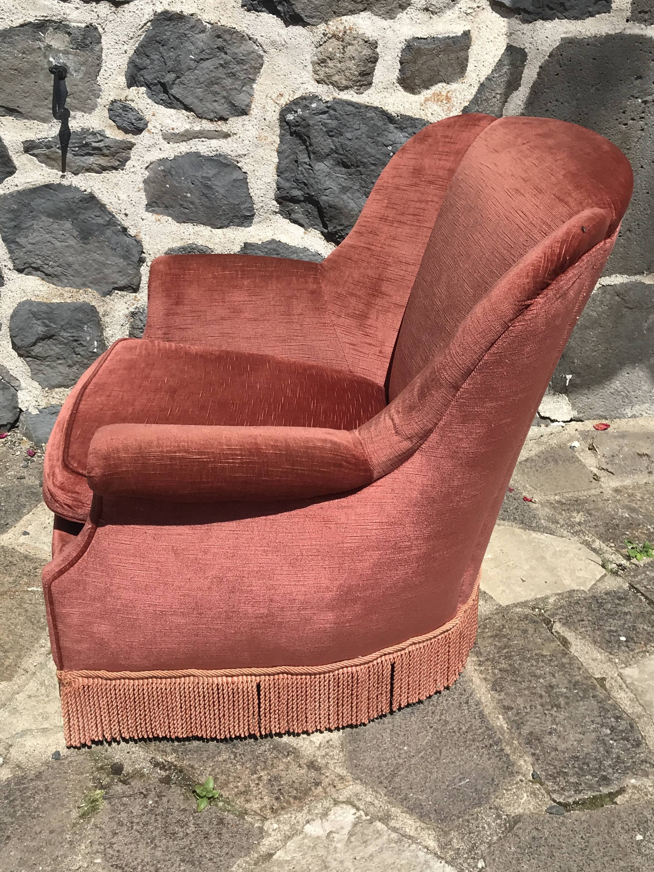 Vintage pink velvet armchair with fringes