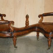 High Victorian leather tête-à-tête canapé with a walnut burr chessboard.