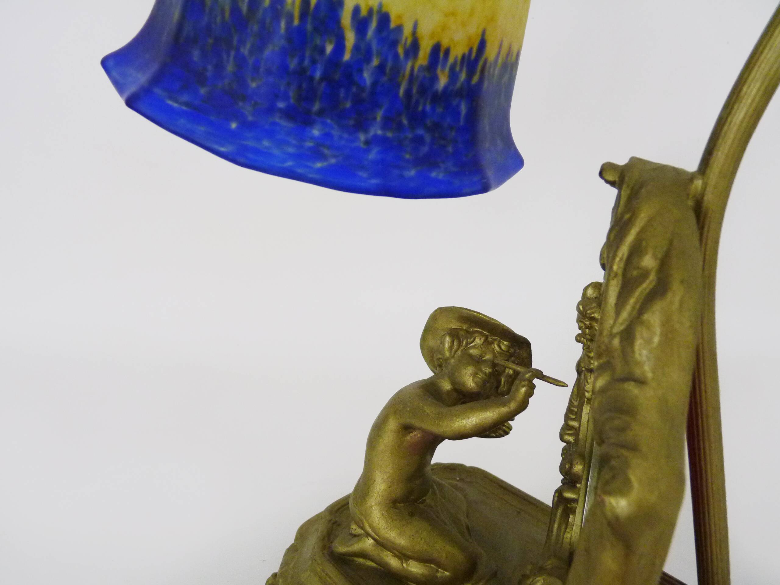 Vintage bronze table lamp featuring a painter on a mirror from the 1960s.