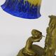 Vintage bronze table lamp featuring a painter on a mirror from the 1960s.