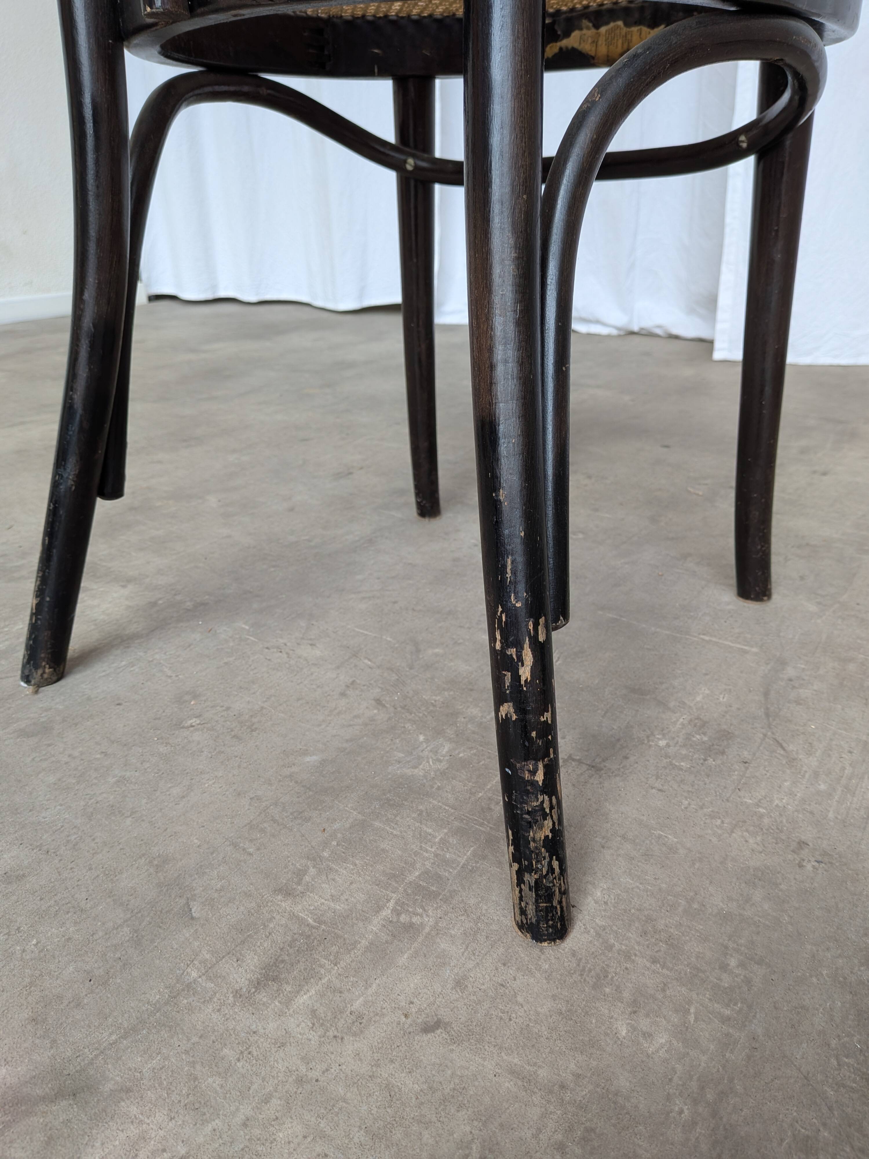 Chaise de salle à manger vintage style Thonet en bois noir et assise en cannage 1970