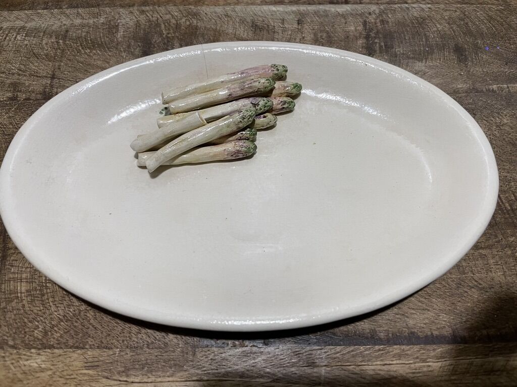 3 plates decorated with vegetables