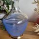 Decanter in blue granite glass and golden borders