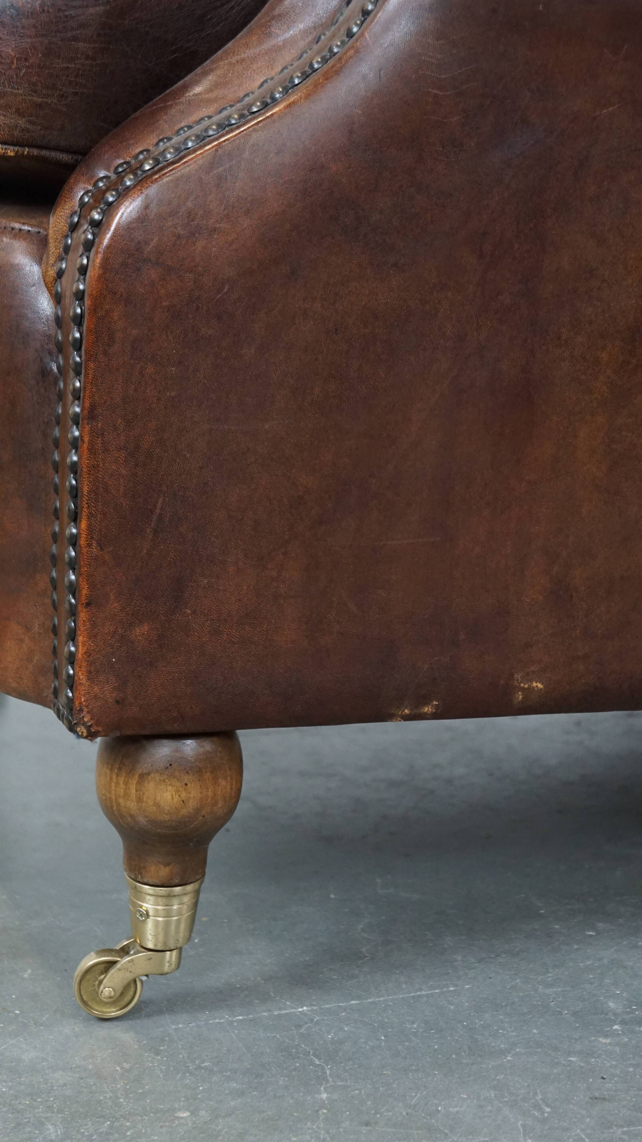 Sheep leather armchair on wheels