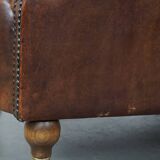 Sheep leather armchair on wheels