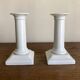 Pair of neo-classical Empire candlesticks from the late 19th century in white porcelain.