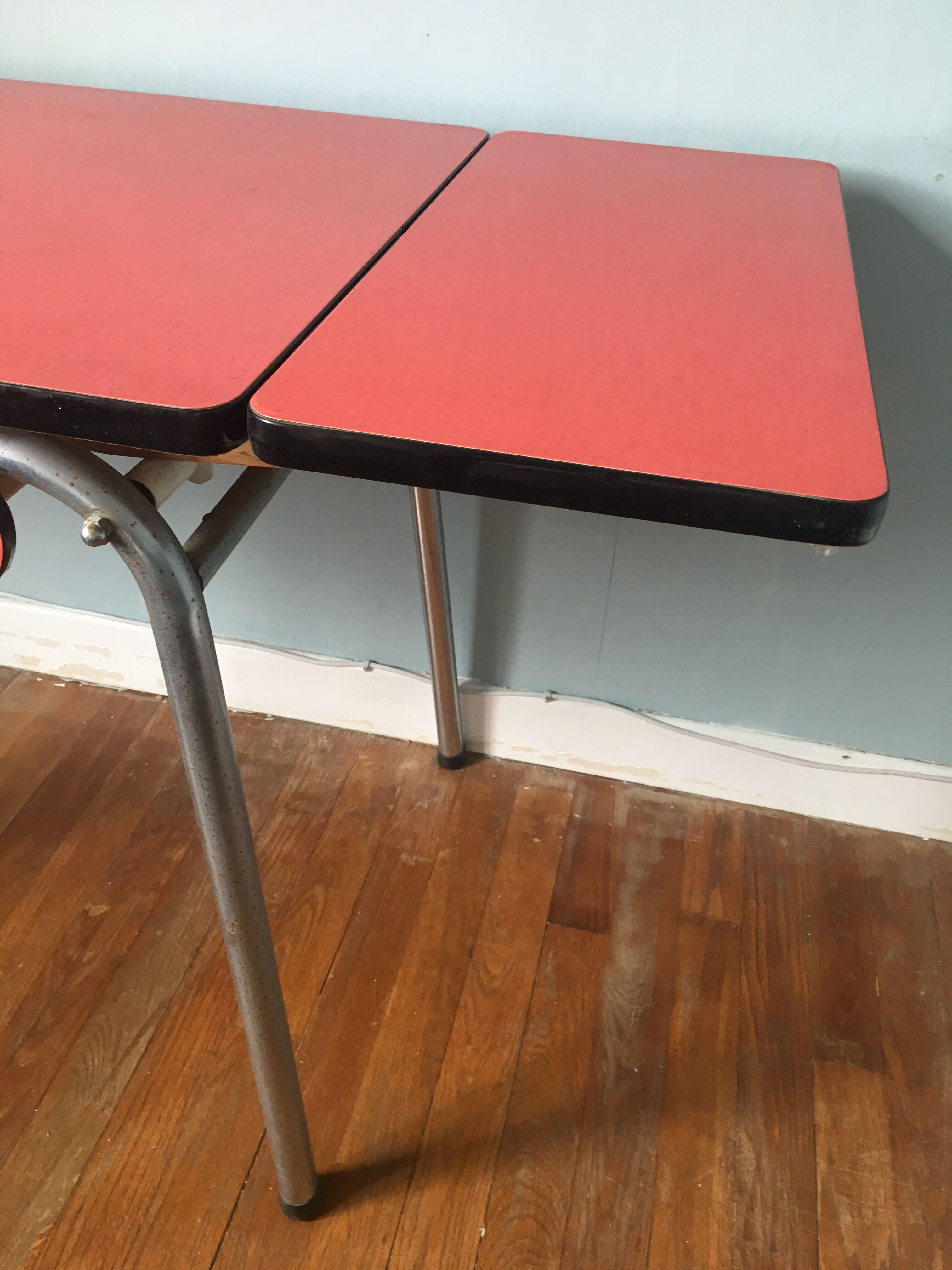 Large table in red formica with extensions + red drawer